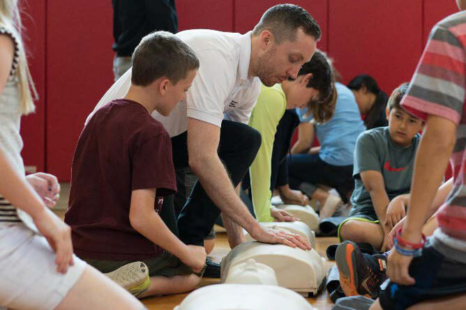 Lake Highlands training CPR in Schools 2