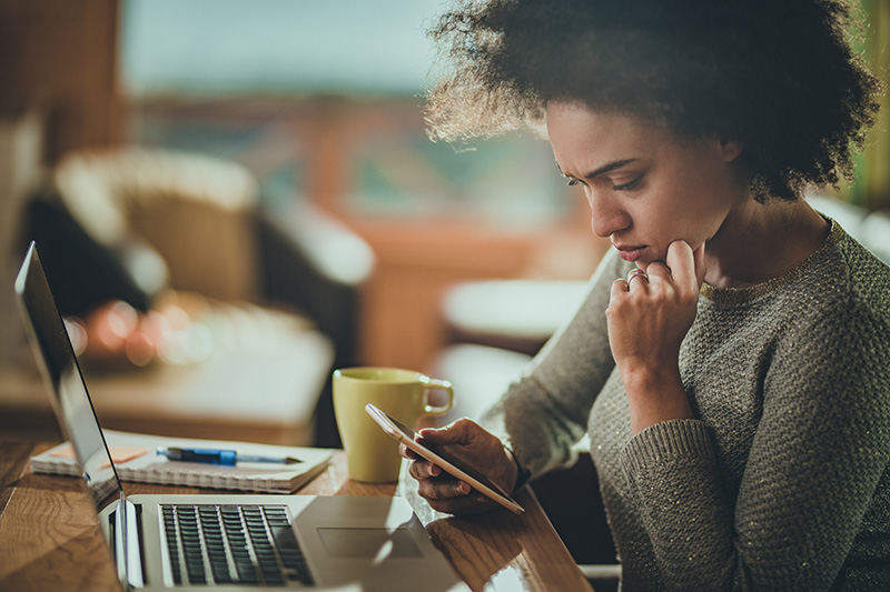 young woman reading phone