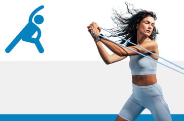 Woman being active by exercising with a resistance band 