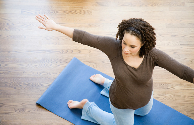 pregnant mother doing yoga