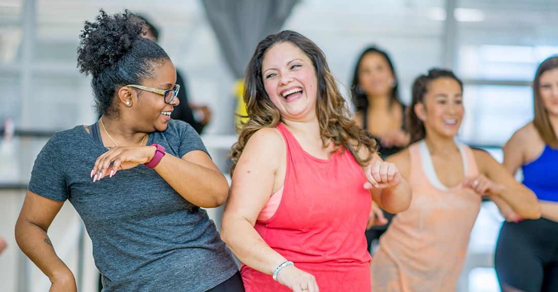 friends dancing in workout clothes friends dancing in workout clothes