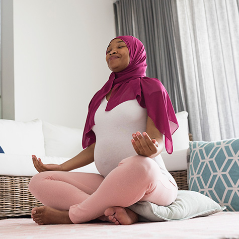pregnant woman meditating pregnant woman meditating